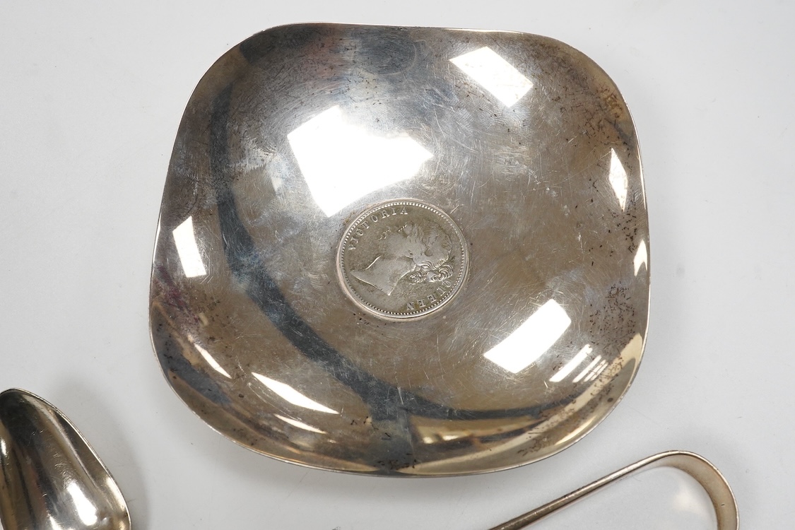 A collection of small silver and white metal items, including an Indian Hamilton & Co small dish, the centre inset with 1840 one rupee coin, one other white metal dish, two modern silver mounted napkin rings, fourteen as